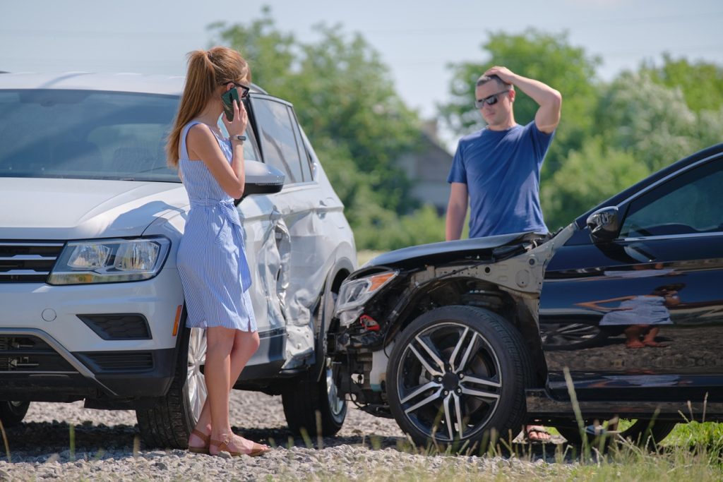 Driver checking damage after a not-at-fault car accident