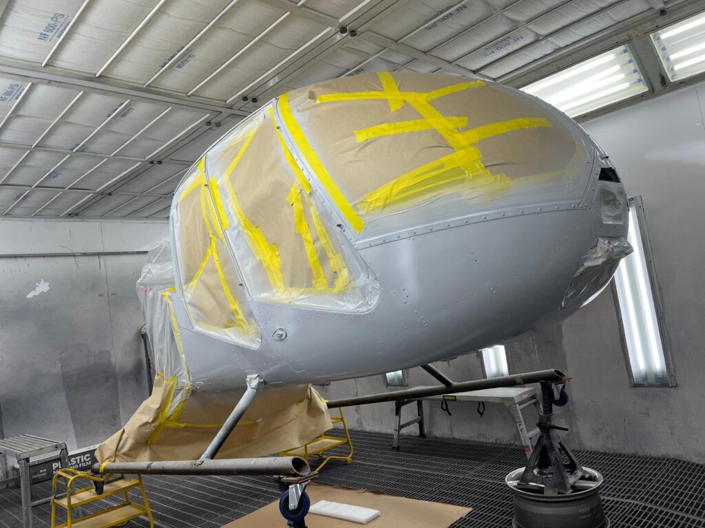 Helicopter cabin in primer and masked up before painting