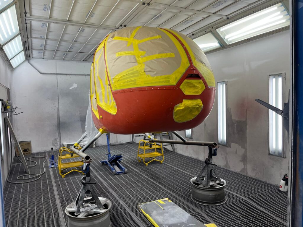 Helicopter nose masked up in the spray booth