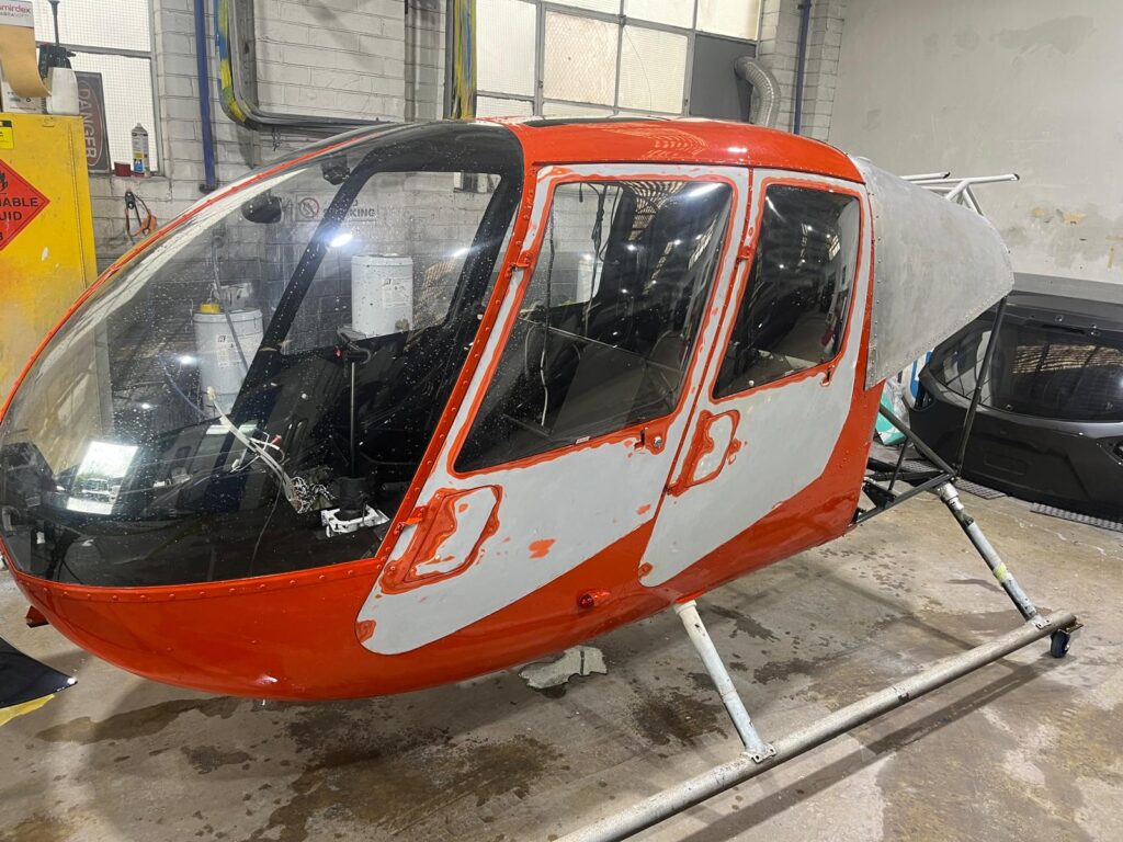 Helicopter cabin stripped back and prepared for respray at Bailey Smash Repairs