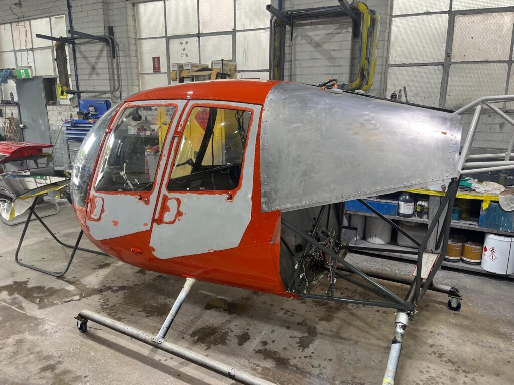Helicopter cabin in its original red and silver paint before the respray