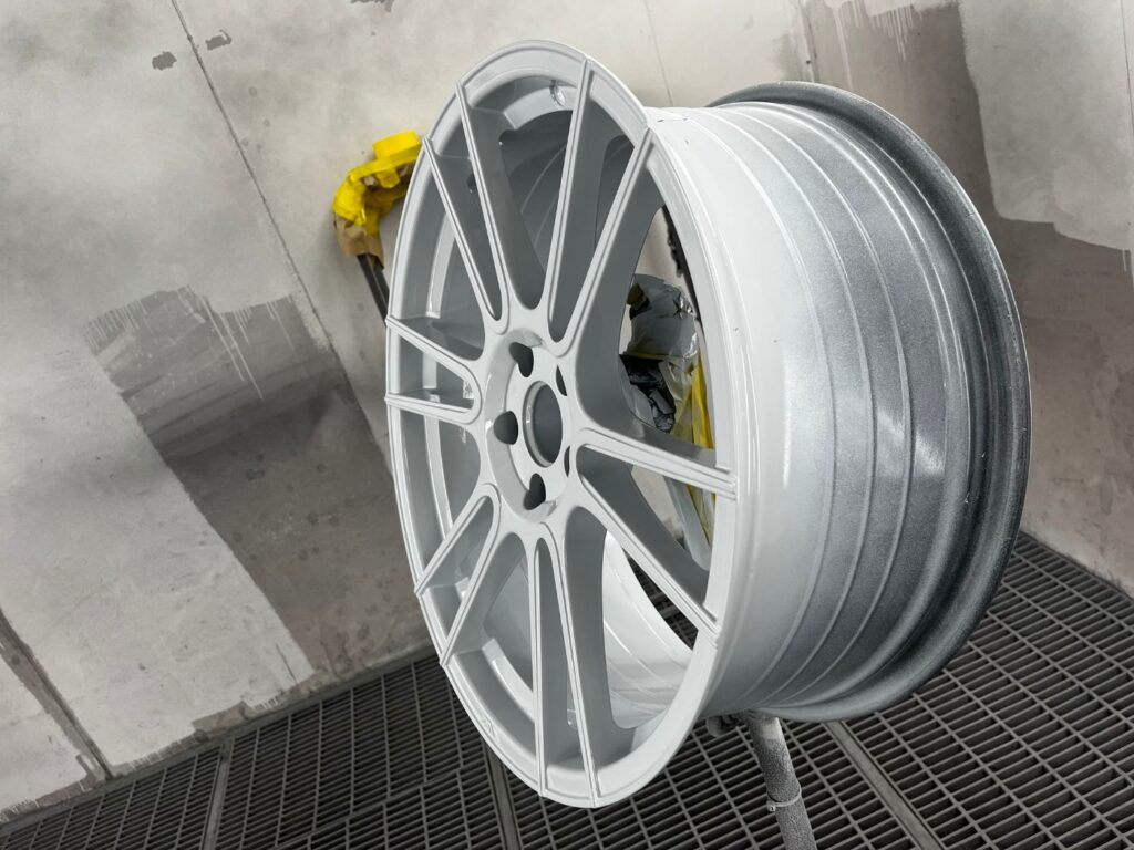 Alloy wheel barrel and spokes refinished in gloss grey