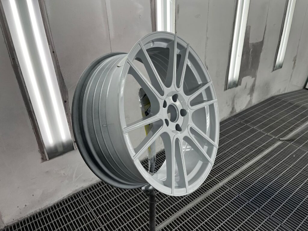 Alloy wheel refinished in gloss grey
