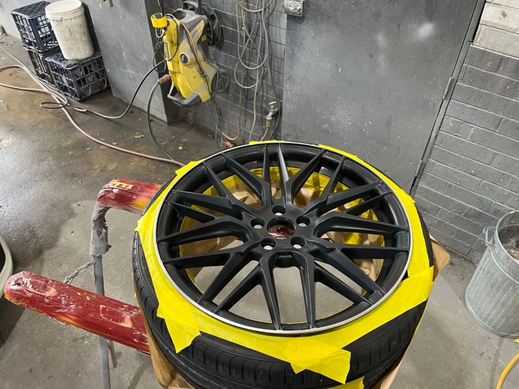 Alloy wheel refinished in gloss black