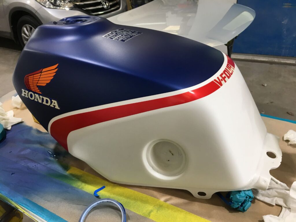 Honda VFR fuel tank in basecoat with decals applied