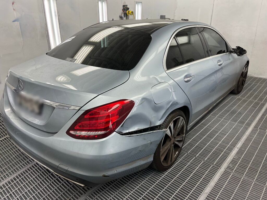 Mercedes-Benz C-Class with rear quarter panel accident damage before repair