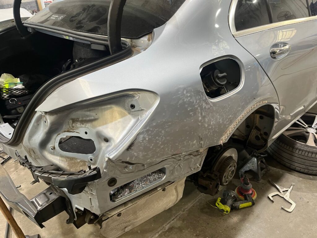 Mercedes-Benz C-Class rear quarter stripped for structural panel repair
