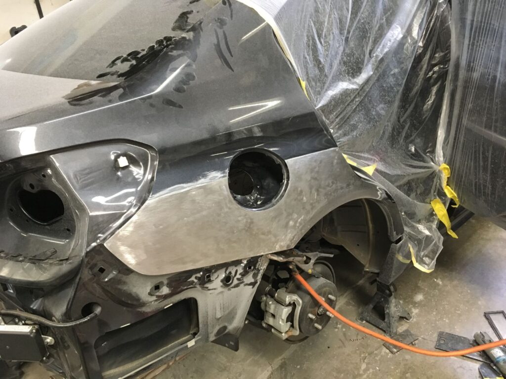 SUV rear quarter panel repair in progress