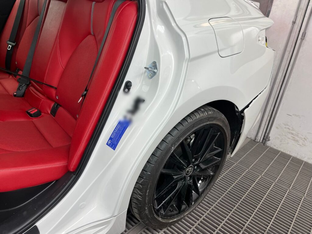 Close-up of Toyota Camry rear quarter paint repair