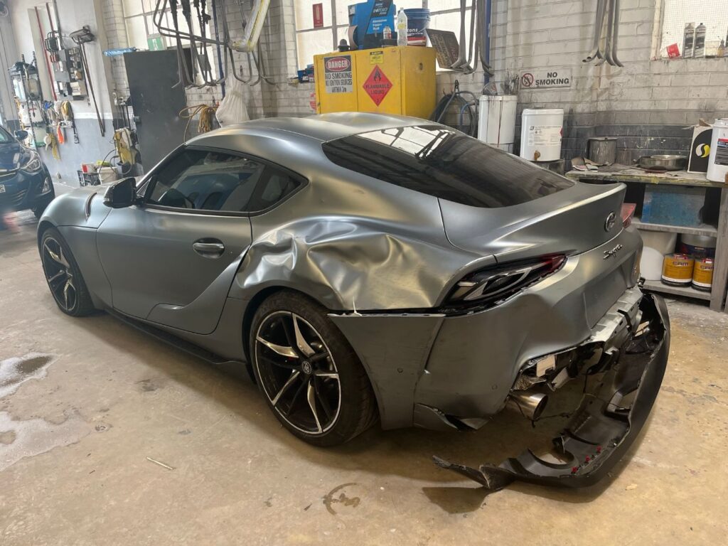 Toyota GR Supra rear collision damage in the workshop