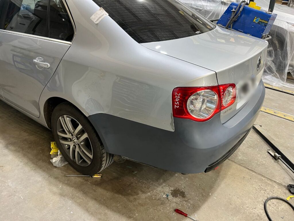 Volkswagen Jetta with new rear bumper primed ready for paint